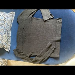 Black knit sweater top with slit opening